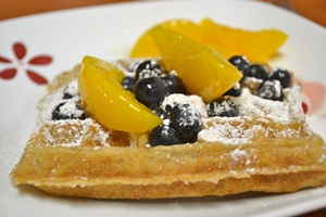 Gluten-free waffles with peaches and blueberries
