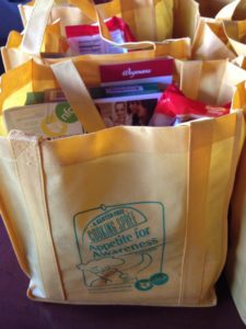 Goodie bags with food samples and informational pamphlets.
