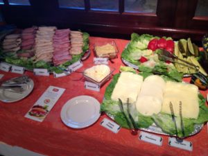 Platters of fresh food on a table.
