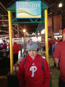 Nancy's grandson in a Phillie's sweatshirt and cap.