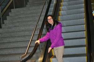 Candice on an escalator