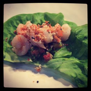 Shrimp on a piece of lettuce. 