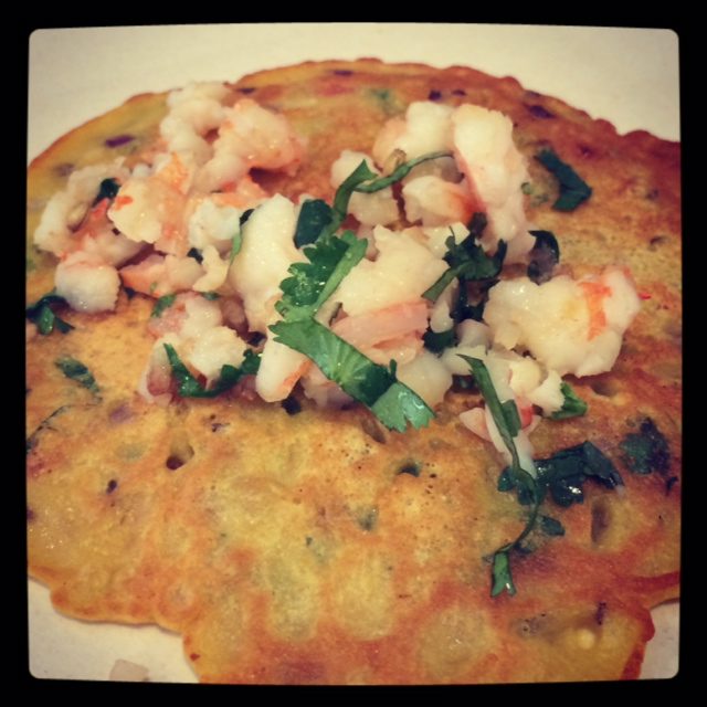 A chickpea pancake with toppings.