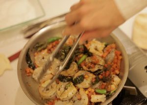 A pot of shrimp and vegetables