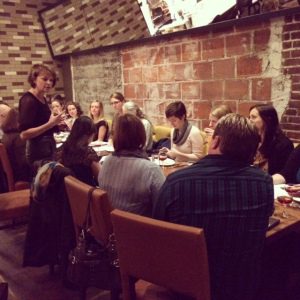 Beckee speaking to the table.