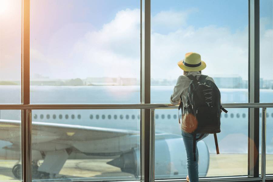 Person staring out an airport window