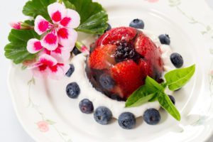 Fruit jelly on a plate with flowers.