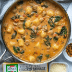 A pot of gnocchi and chicken sausage stew. An empty Jones Dairy Farm box is in the lower left corner.