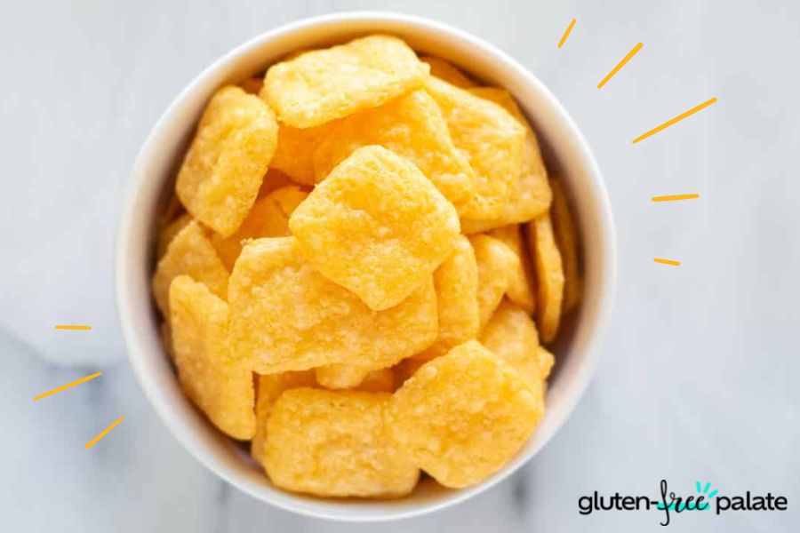A bowl of cheese crackers. To the right is the Gluten-Free Palate logo. 