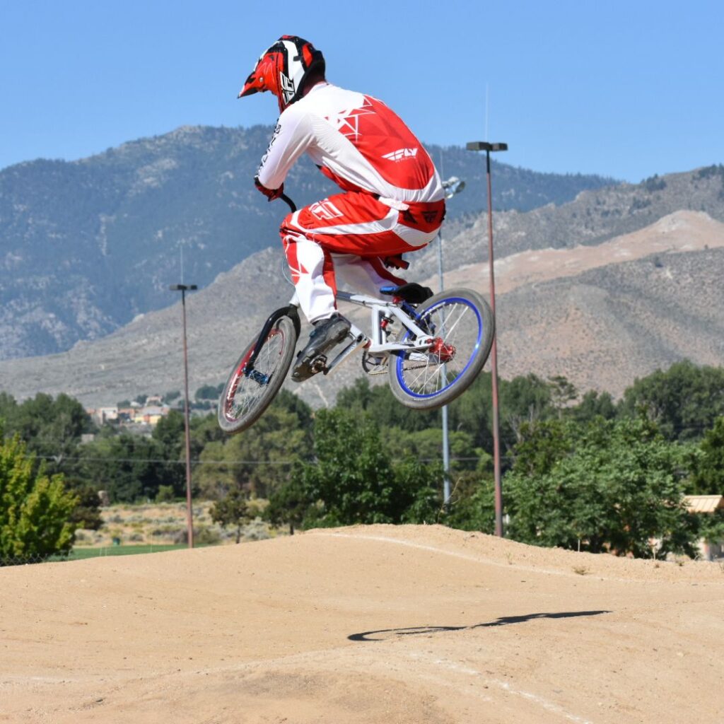 Hunter jumping in the air on a dirt bike.
