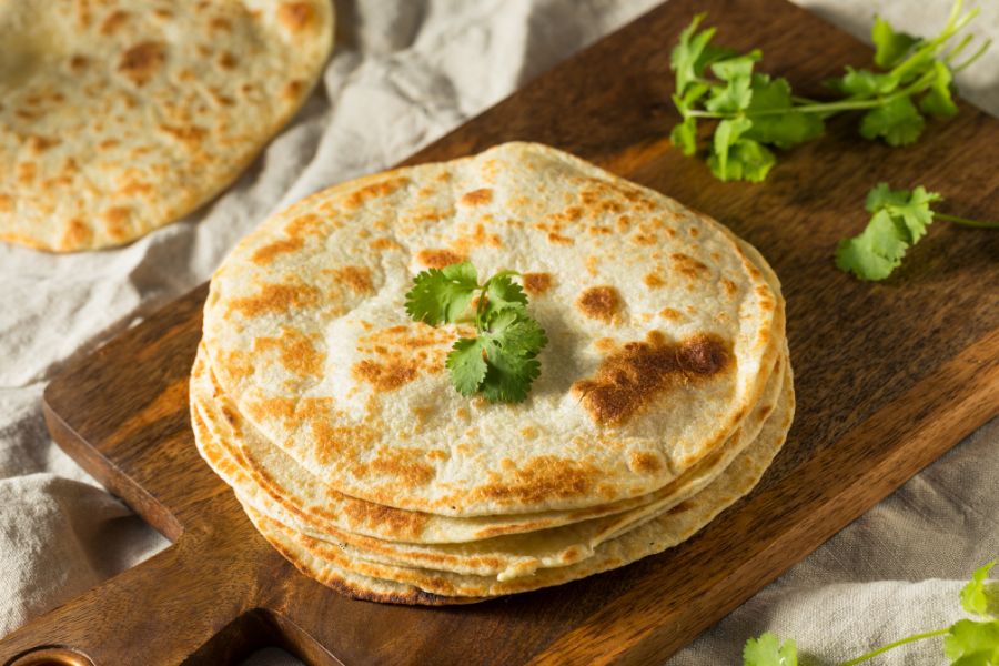 A plate of roti with a garnish of coriander.