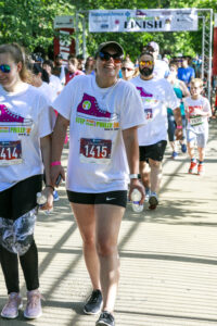 5K participants from the 2019 Philadelphia race. All are wearing their race shirts and smiling. 