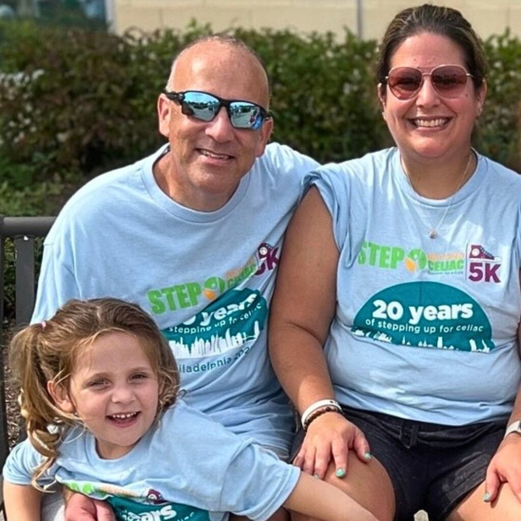 A photo of Paige and her family in Step Beyond Celiac 5K t-shirts.