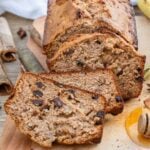 A loaf and three slices of the cinnamon raisin bread.