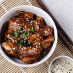 A bowl of teriyaki chicken.