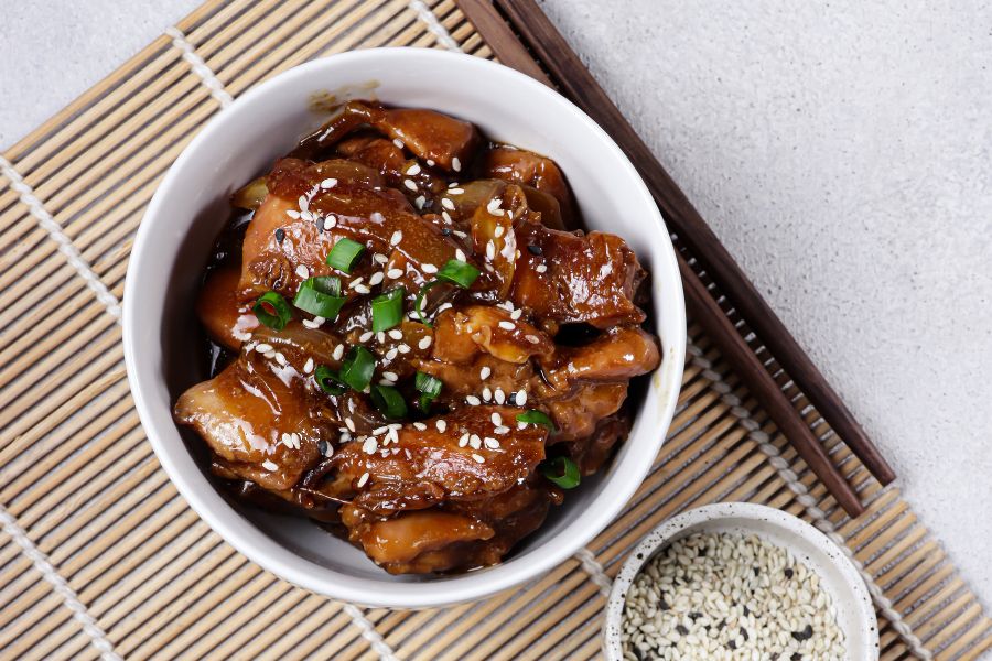 A bowl of teriyaki chicken. 