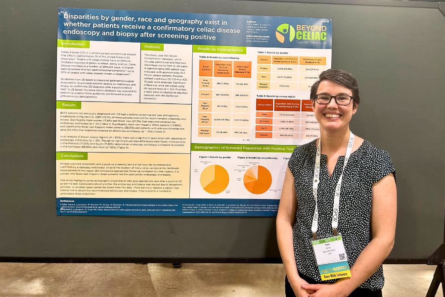 A photo of Kate Avery, MPH, Senior Director of Coalition and Patient Engagement, in front of our poster at ISPOR 2024.
