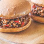A platter with two sloppy joes.