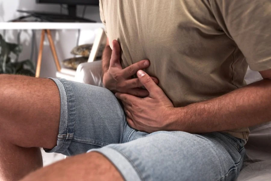 A person holding their stomach.