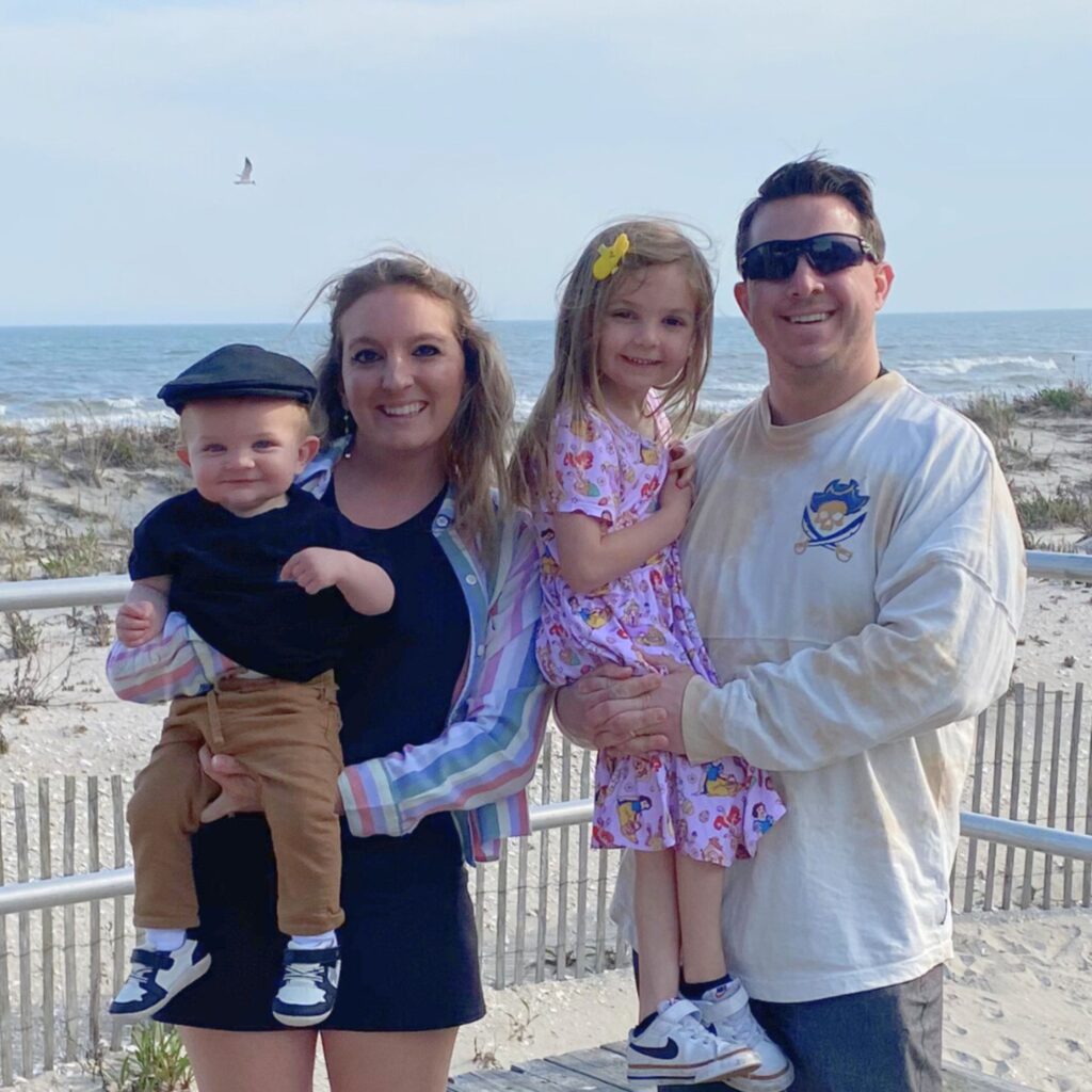 A photo of Courtney with her family at the beach.