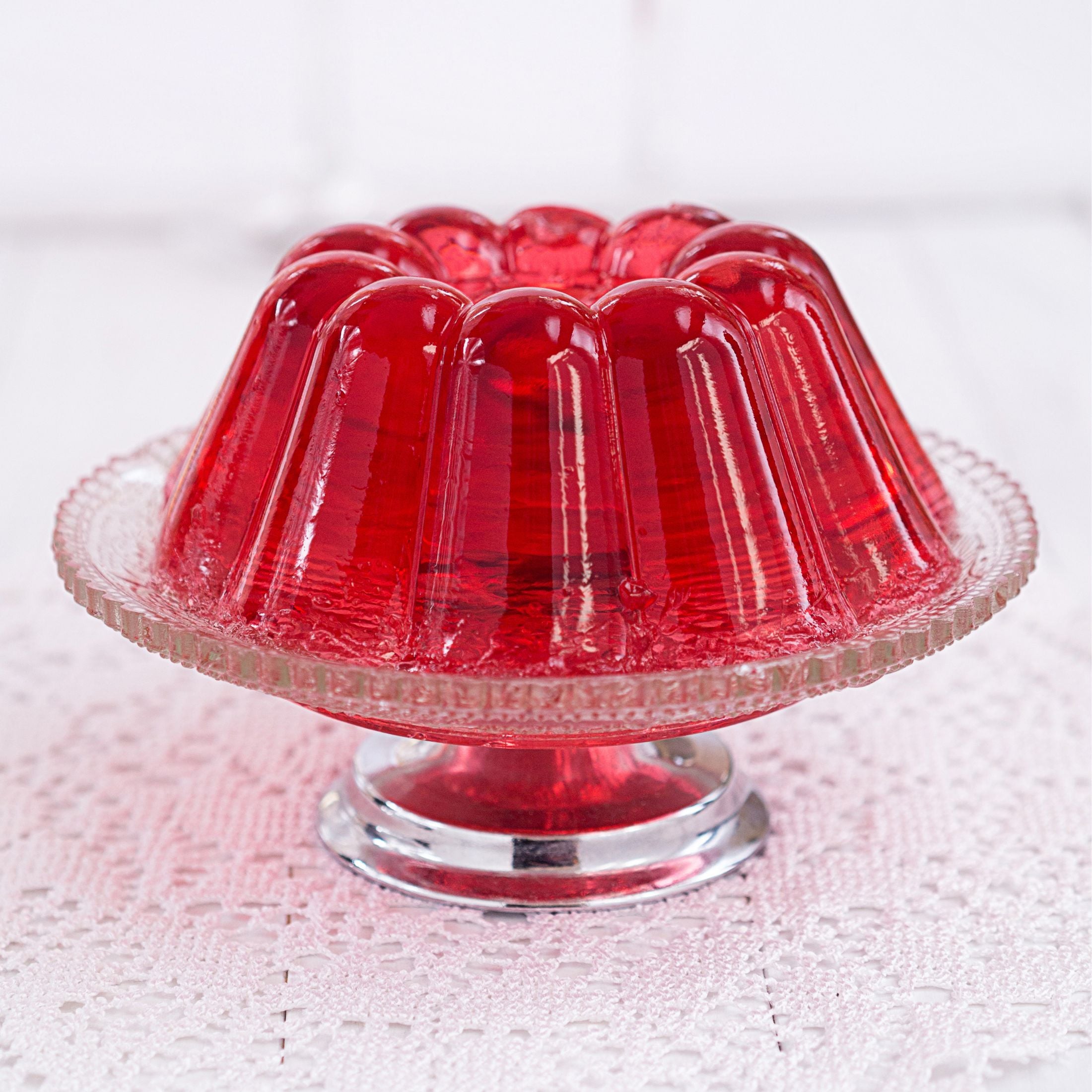 A serving plate of red gelatin dessert. 