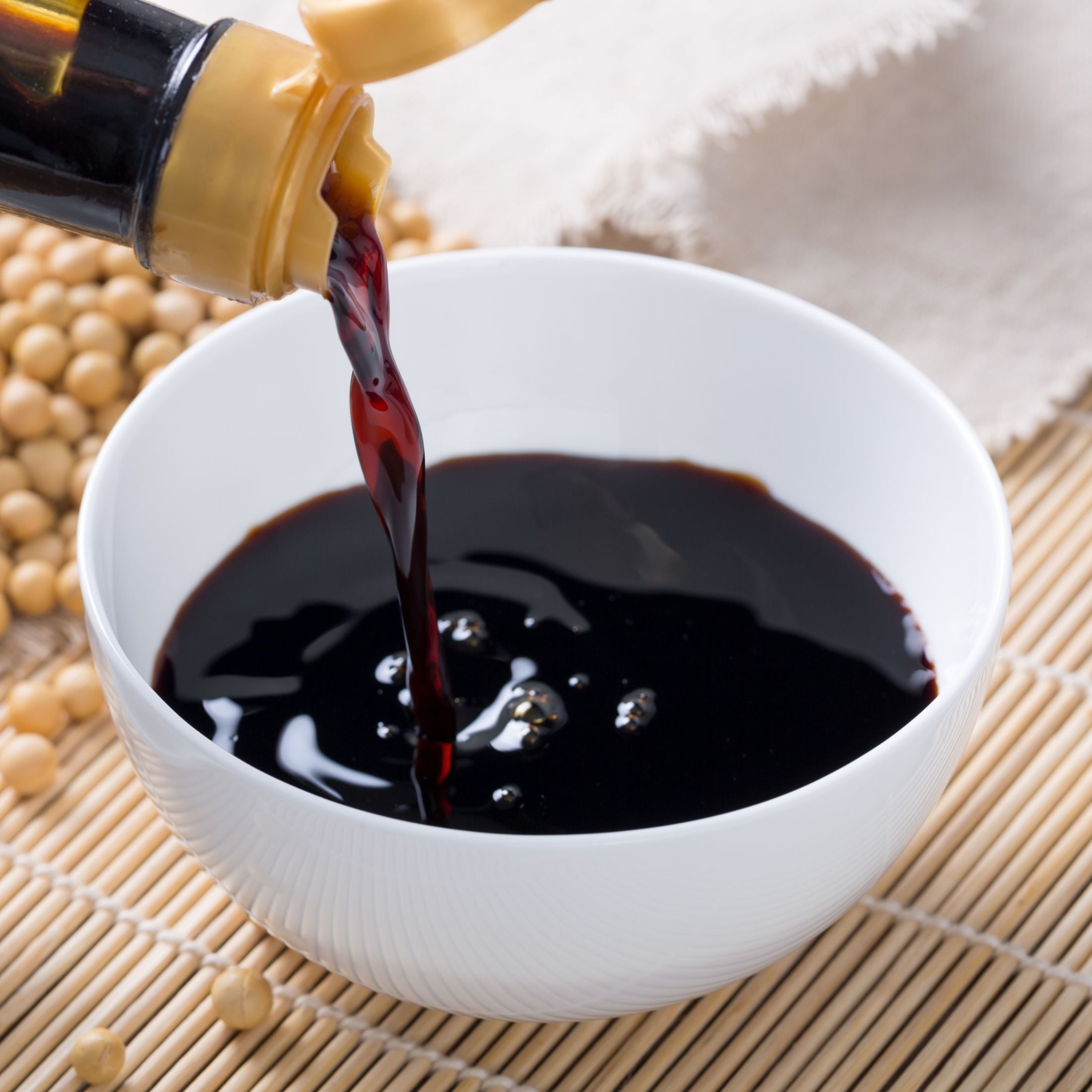 A bowl of soy sauce.