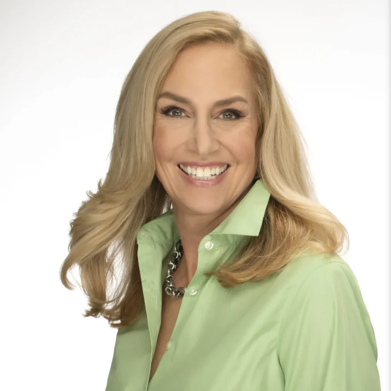 A headshot of Alice Bast smiling.